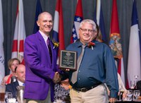 Craig Askim, right, receives the National Association of County Agricultural Agents' national Distinguished Service Award. (NDSU photo)