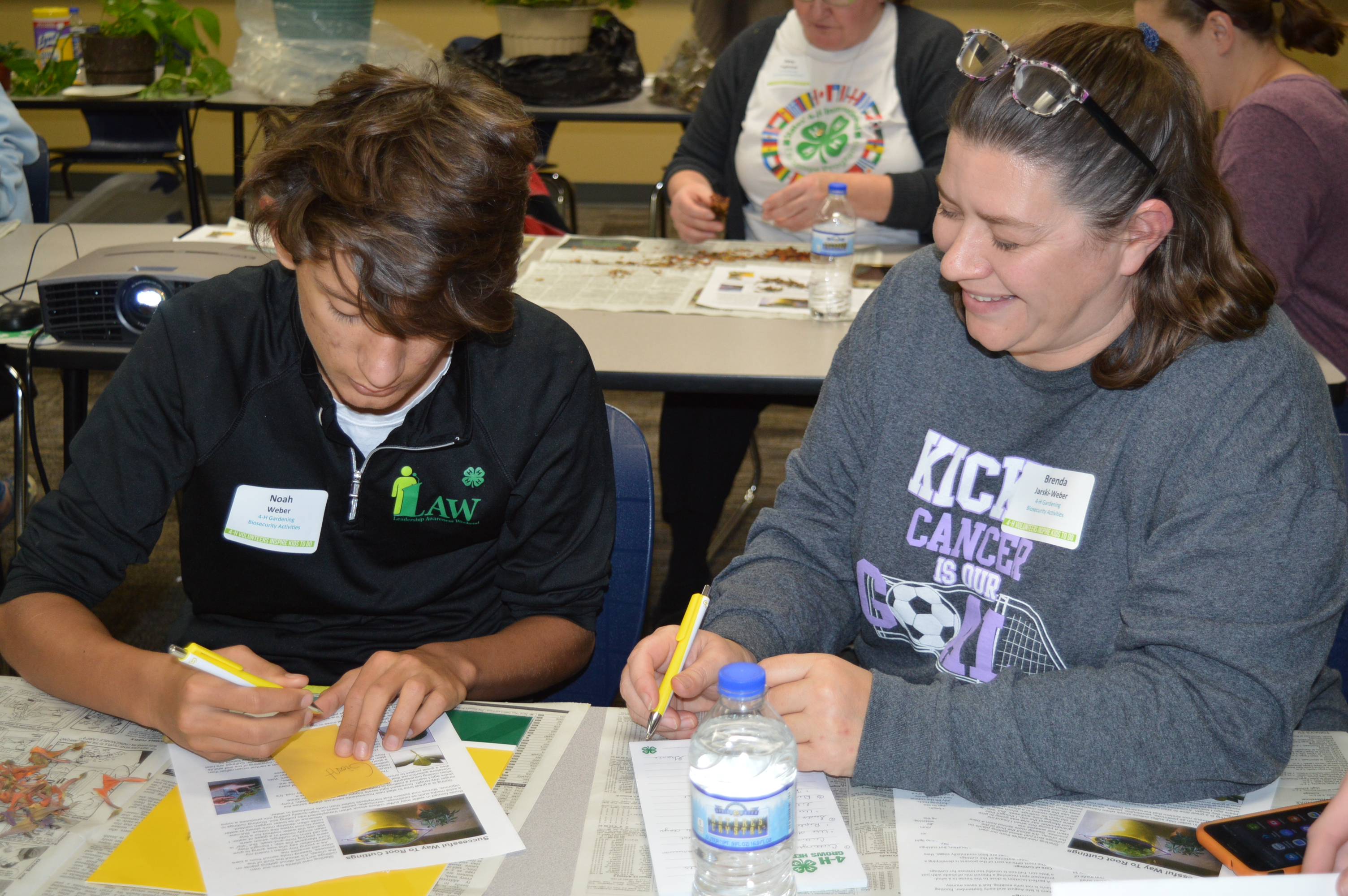 Noah Weber, a 4-H youth volunteer, and Brenda Weber, a 4-H adult volunteer, both of Stutsman County, participate in 4-H volunteer project training in Finley, N.D. (NDSU photo)