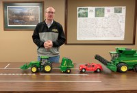 NDSU Extension agent Rick Schmidt uses models to demonstrate road safety involving farm equipment. (NDSU photo)