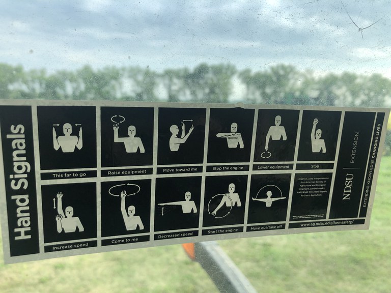 These hand signals can enhance communication and promote farm safety. (NDSU photo)