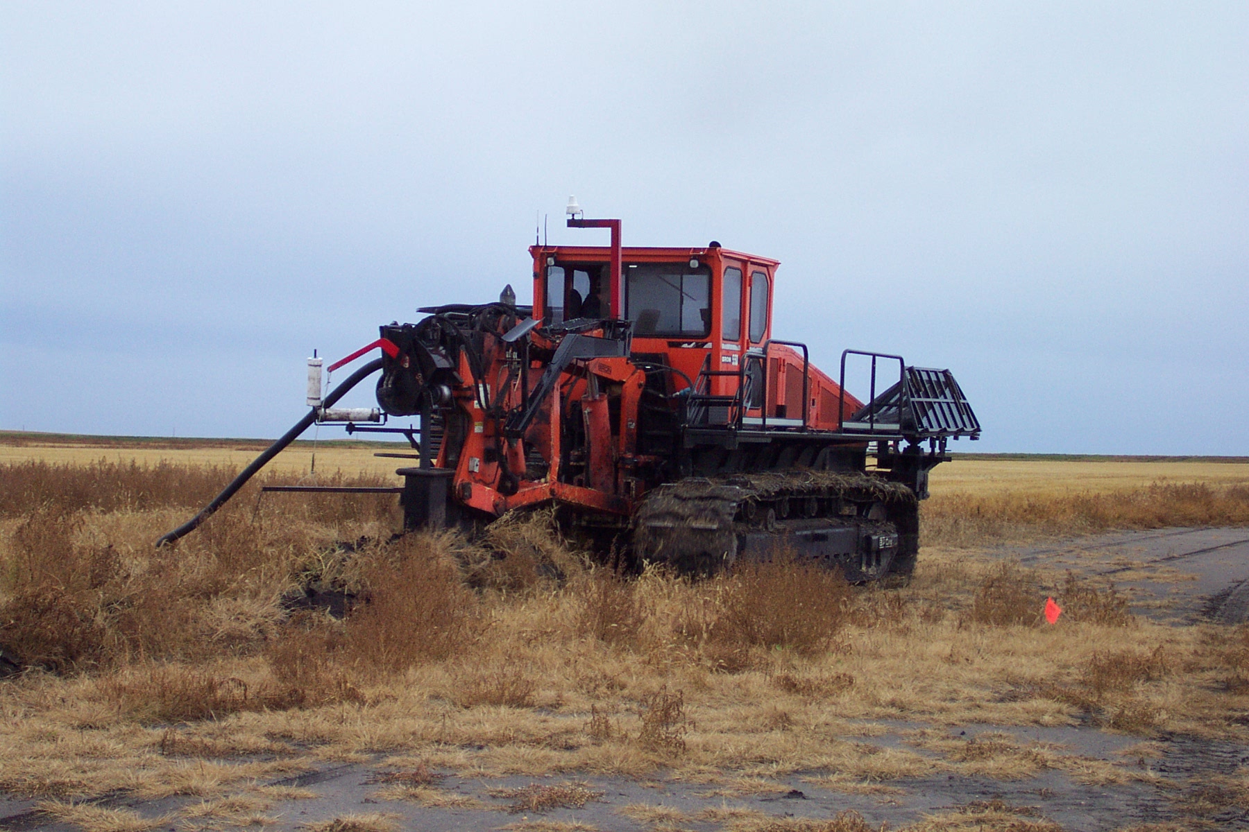 A tile plow installs drainage tiles near Devils Lake. (NDSU Photo)