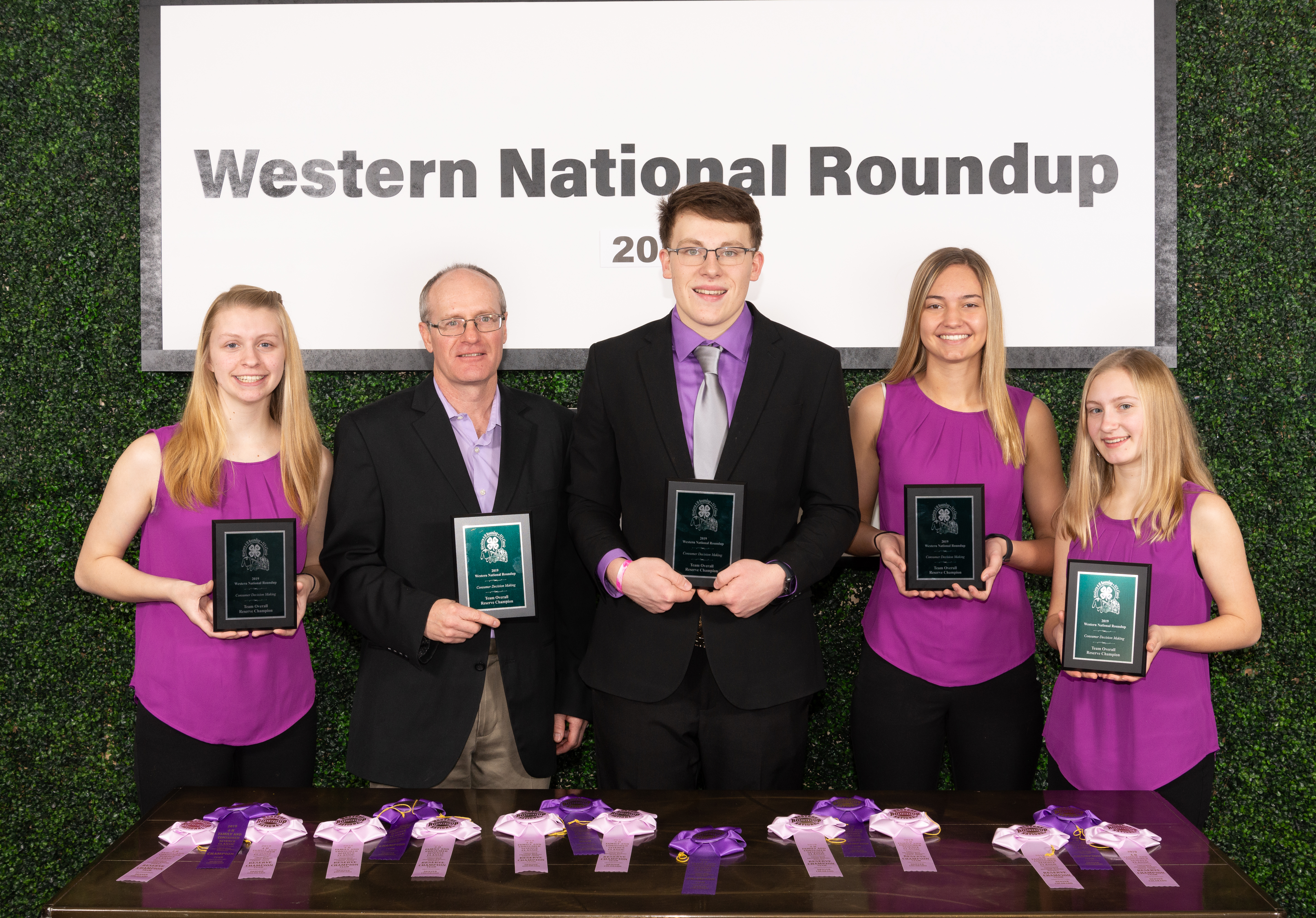The Oliver County team placed second in consumer decision making at the Western National Roundup in Denver, Colo. Pictured are (from left) team member Morgyn Miller, coach Rick Schmidt, and team members Jacob Klaudt, Breanna Vosberg and Reanna Schmidt. (Photo courtesy of Western National Roundup)