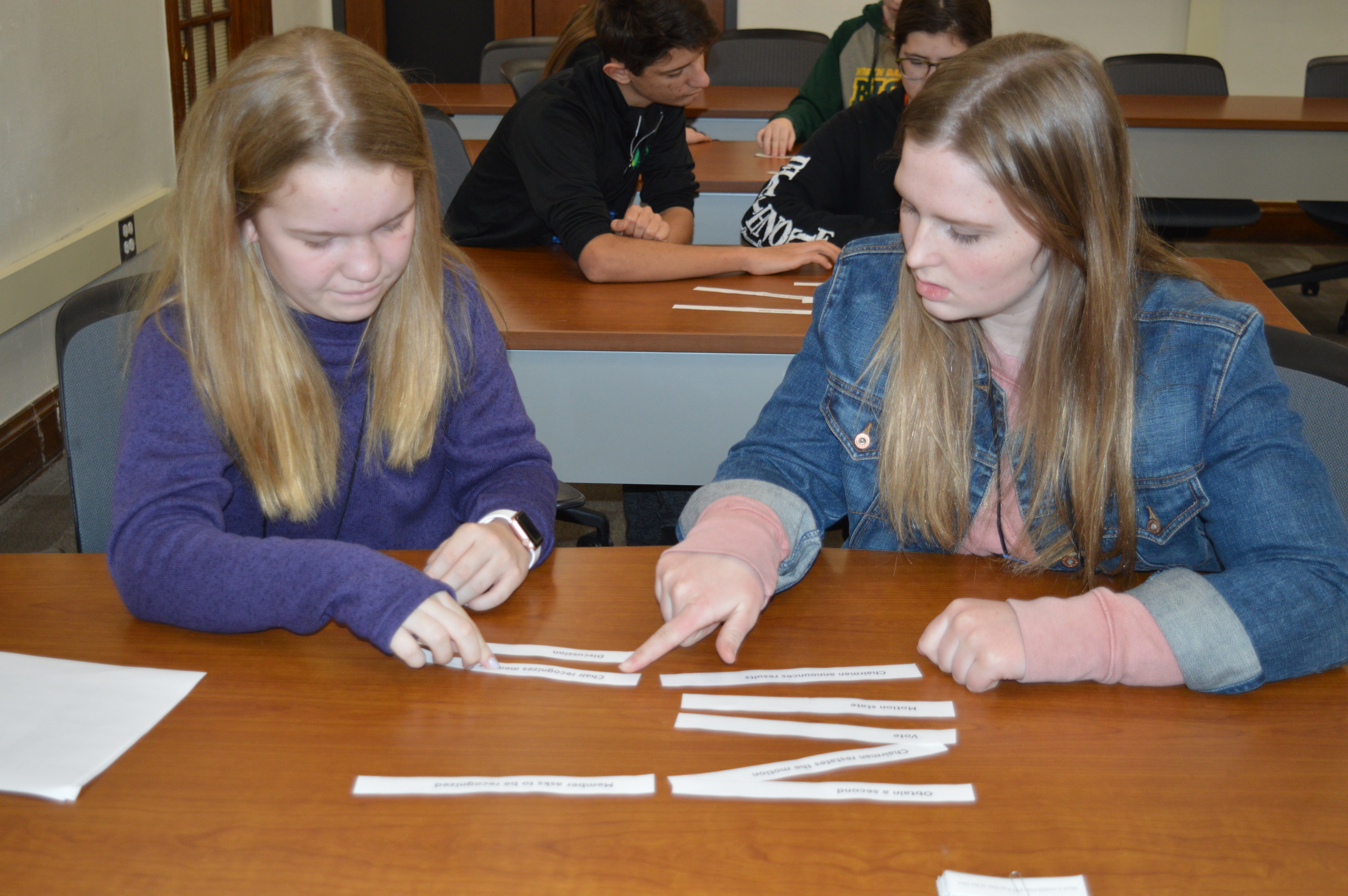 Youth learn about the judicial system by deciphering puzzles to get codes that opened locks on a box during the Leadership Awareness Weekend that NDSU Extension's Center for 4-H Youth Development hosted. (NDSU photo)