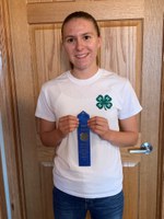 Faith Norby shows off her award from the 2020 North Dakota 4-H consumer decision making contest. She is a member of the Stark-Billings County team who took first place in the senior division. (NDSU photo)