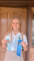 Reilly Meyer, who is displaying her awards, is a member of the Stark-Billings County team who took first place in the senior division of the 2020 North Dakota 4-H consumer decision making contest. (NDSU photo)