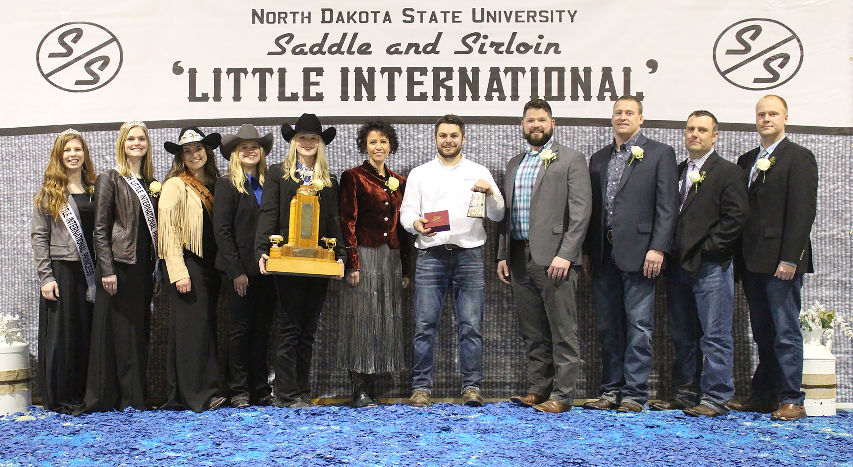 Mitch Molitor, a senior in agricultural economics from Watkins, Minn., was named the overall showman at the 95th Little International at North Dakota State University Feb. 13. Pictured L to R: Maddie Patterson and Annabelle Hardwick, Little I Princesses; Samantha Pernsteiner, Little I Queen; Ashlyn Dilley, Little I Assistant Manager; Kadey Holm, Little I Manager; Julie Ellingson, Little I Agriculturist of the Year; Molitor; Cole Rupprecht, Dairy judge; Ben Hawkins, Cattle judge; Jeremy Lehrman, Swine judge; and Isaiah Bauck, Sheep judge. (NDSU photo)