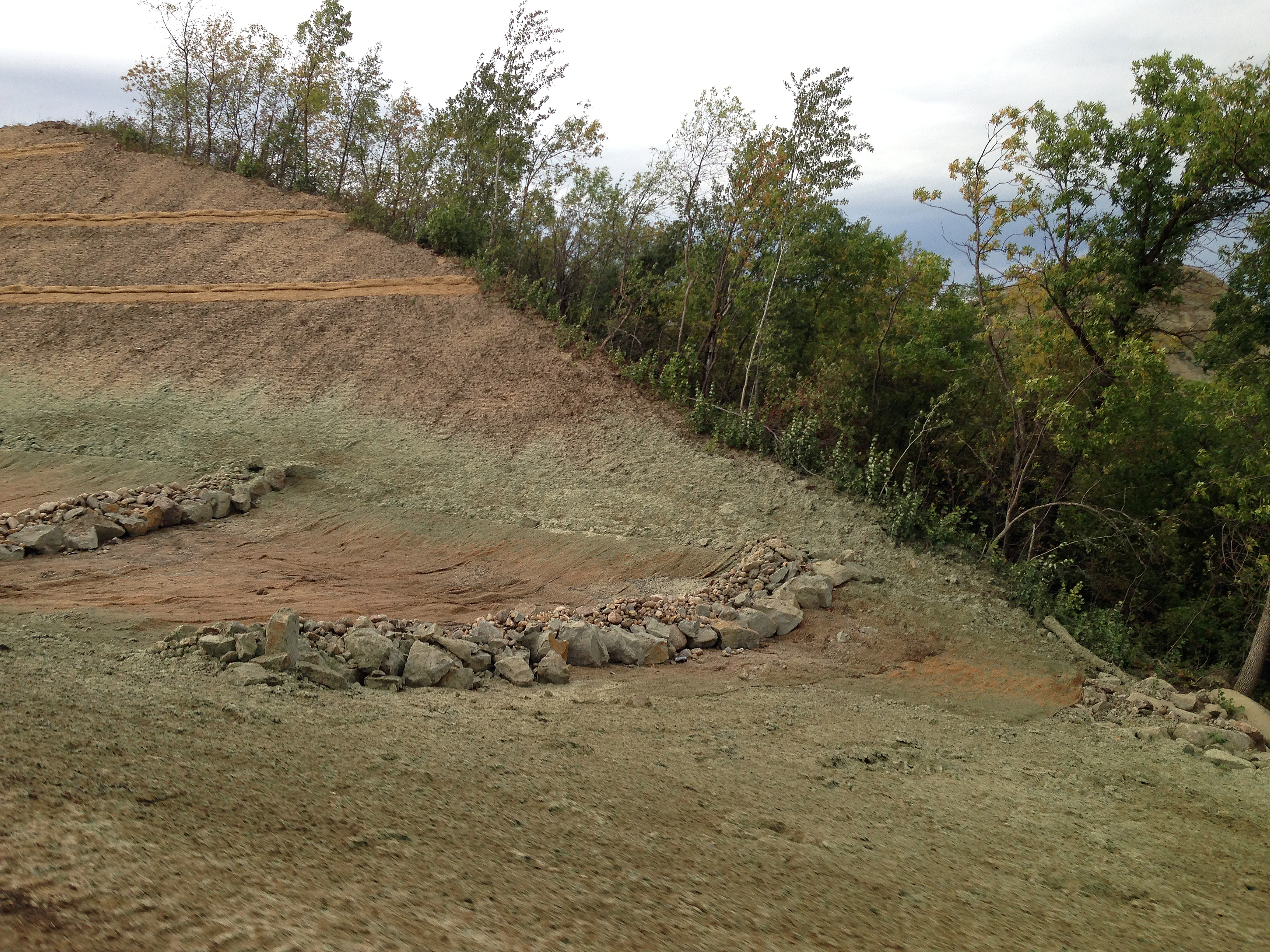 This is an example of using multiple erosion control methods to reduce sediment movement and aid in the restoration of the seeding. (NDSU photo)