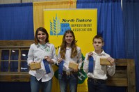 This team placed first in the junior division of the North Dakota state 4-H crop judging contest in Valley City. Team members are (from left) Rosie Abraham, Amelia Abraham and Leo Lahlum. (NDSU photo)