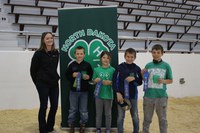 The Grand Forks County team received first place in the junior division of the state 4-H meat judging contest. Pictured, from left, are: coach Katelyn Landeis and team members Cody Draxton, Madison Todd, Bernt Draxton and Levi Todd. (NDSU photo)