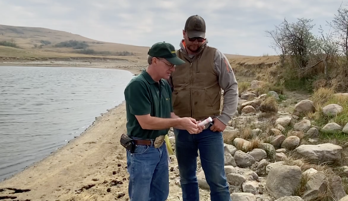 Rick Schmidt, NDSU Extension - Oliver County agent, tests the quality of a livestock water source. (NDSU photo)