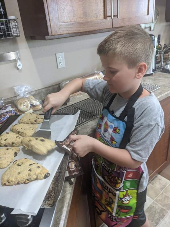 4H'er learns about healthful cooking in NDSU Extension's On the Move to Better Health Kids Cooking School. (NDSU photo)