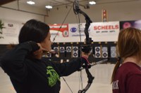 A 4-H'er takes a shot during the North Dakota 4-H Archery Indoor Championship. (NDSU photo)