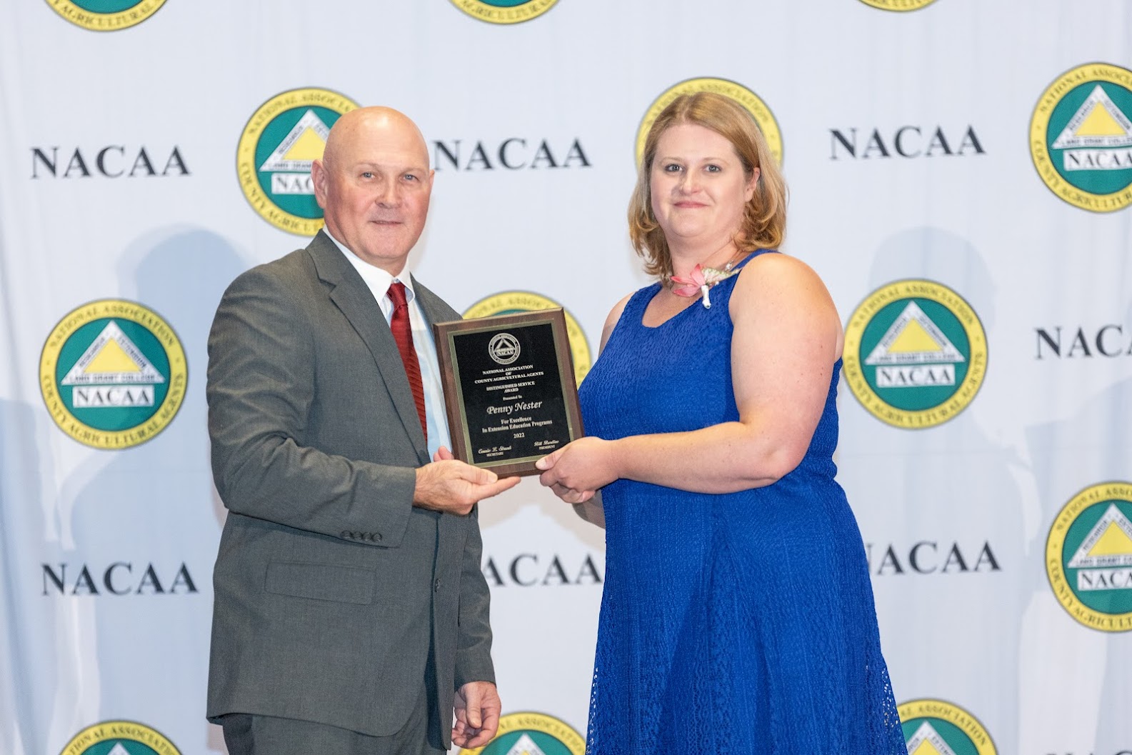 Penny Nester, right, receives the National Association of County Agricultural Agents' national Distinguished Service Award. (Photo courtesy of NACAA)