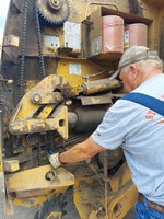 An infrared thermometer can alert farmers of dangerous temperature spikes at the bearings. (NDSU photo)