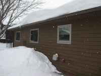 Most roofs are designed to handle the snow load of a typical winter. (NDSU photo)