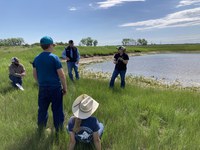 NDSU Extension ANR Agent Rachel Wald discusses livestock water quality and demonstrates water screening to producers during a pasture walk in McHenry County.