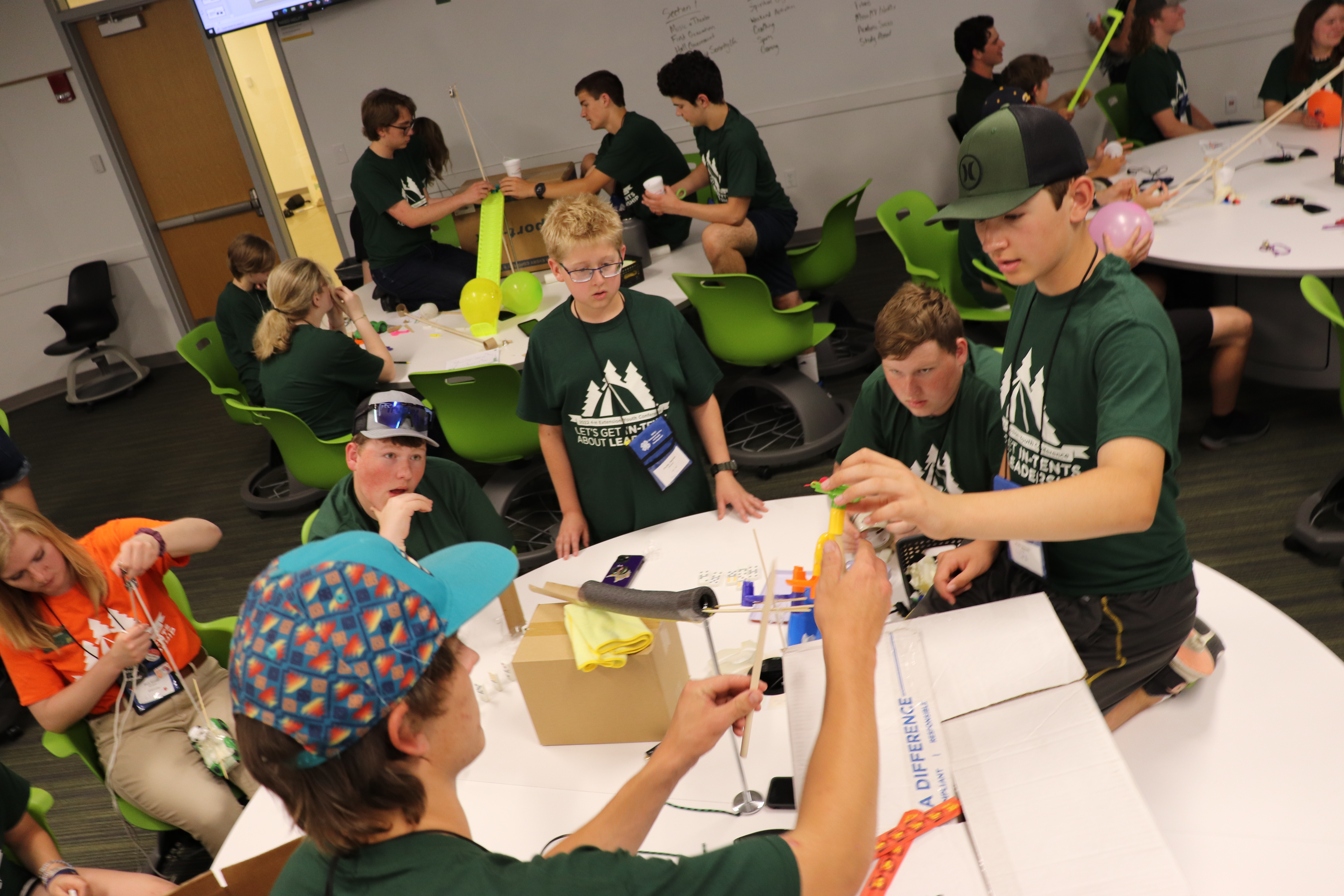 Extension Youth Conference participants work in teams on a skill-building exercise during the four-day event. (NDSU photo)