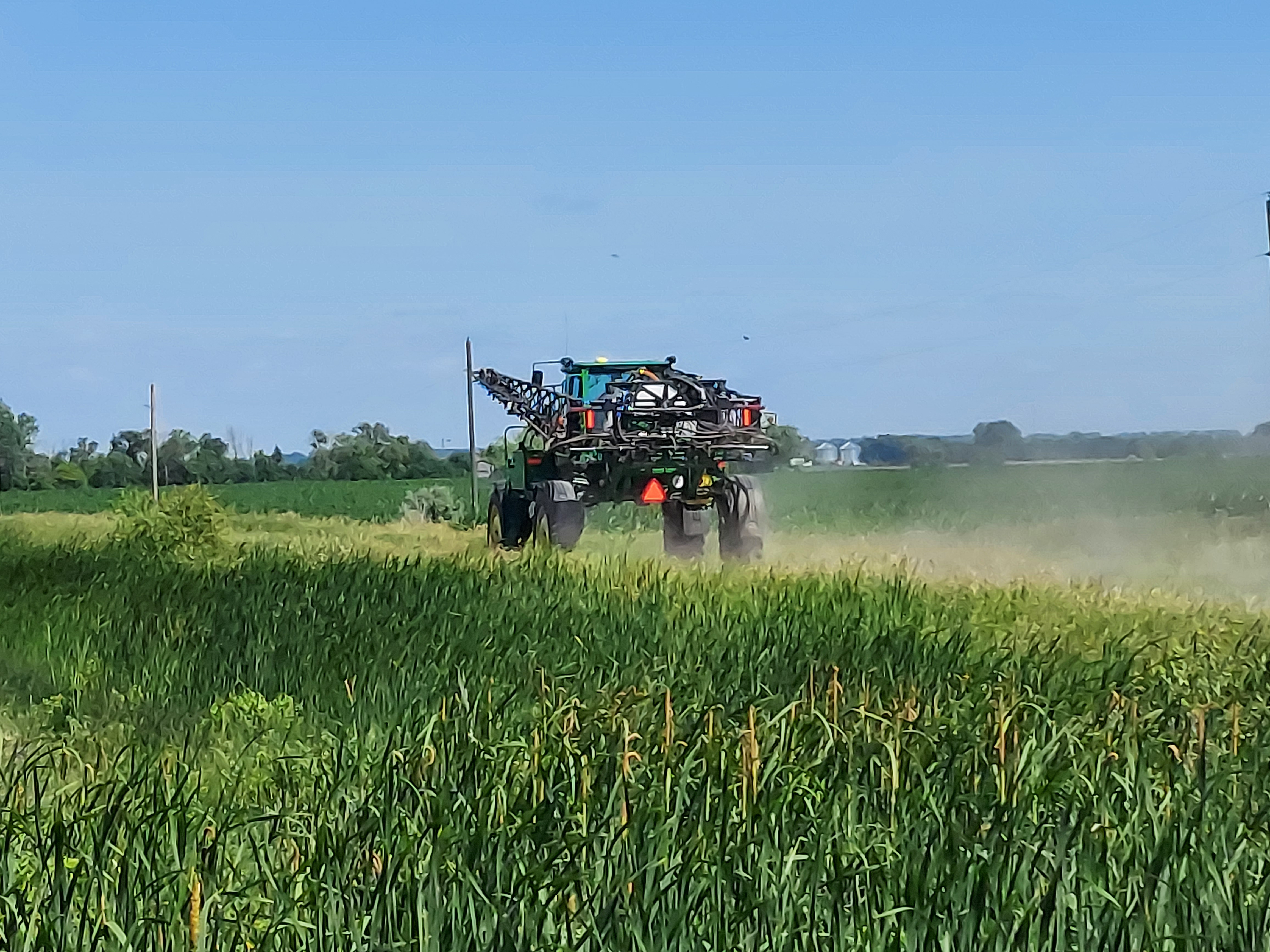 The slow-moving vehicle sign on this sprayer increases visibility and warns motorists to slow down. (NDSU photo)