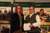 Jim Sailer (R) received NDSU Extension's Friend of Extension award. Pictured with Jodi Bruns (L), NDSU leadership and civic engagement specialist and president of Upsilon chapter of Epsilon Sigma Phi.
