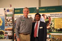 Mohamed Khan (R) received the NDSU Extension Communicator of the Year award. Pictured with Bruce Sundeen (L) representing the North Dakota chapter of the Association for Communication Excellence.