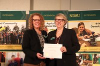 NDSU Extension associate director Lynette Flage (R) received the Administrative Leadership Award. Pictured with Jodi Bruns (L), NDSU leadership and civic engagement specialist and president of Upsilon chapter of Epsilon Sigma Phi.
