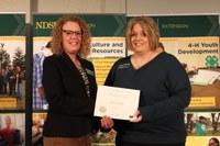 NDSU Extension agent Karla Meikle (R) received the Mid-Career Service Award. Pictured with Jodi Bruns (L), NDSU leadership and civic engagement specialist and president of Upsilon chapter of Epsilon Sigma Phi.