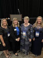 NDSU Extension family and community wellness professionals Mettan Pfilger, Julie Garden-Robinson, Ellen Bjelland and Shaundra Ziemann-Bolinske attend the National Extension Association of Family and Consumer Sciences award ceremony. (NDSU photo)
