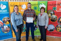 The Jason and Carrie Odenbach family is recognized as a North Dakota 4-H Century Family. Pictured are (from left): Carrie and Jason Odenbach and Deb Clarys, North Dakota 4-H Foundation chair. (NDSU photo)