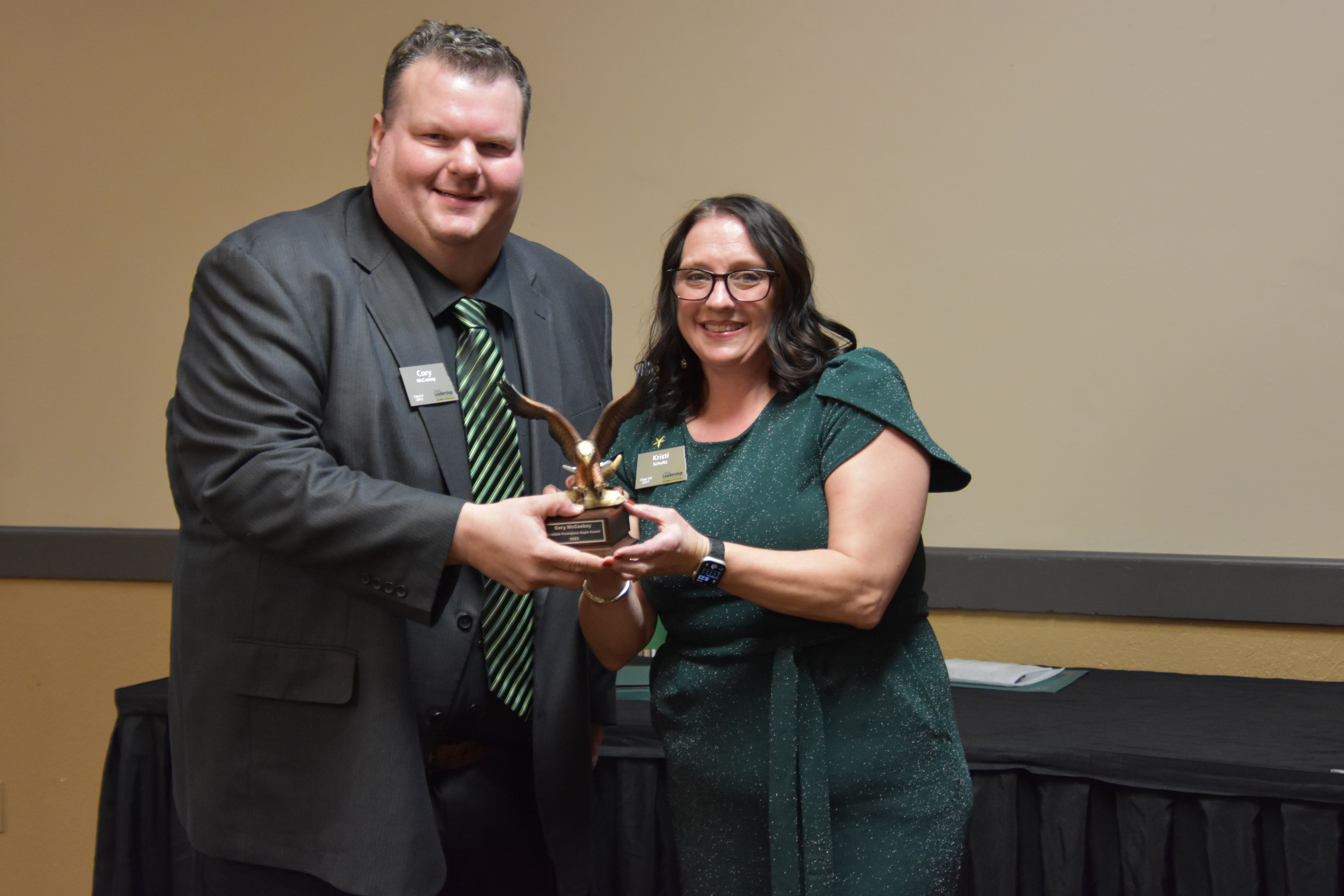 Cory McCaskey of Rural Leadership North Dakota Class V received the RLND Eagle Award, presented by Kristi Schultz. (NDSU photo)