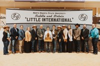 Rose Wendel (pictured center), a freshman in liberal arts from Lamoure, North Dakota, was named the overall showman at the 97th Little International at North Dakota State University on Feb. 11.  (NDSU photo)