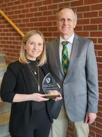 Magan Lewis vividly remembers traveling to NDSU with her dad as a high school student, excited to conduct scientific research. On March 17, Greg Lardy, NDSU vice president for Agricultural Affairs (right) presented her with the 2022 NDSU College of Agriculture, Food Systems, and Natural Resources Distinguished Alumni Award for her contributions to global agricultural science and technology. (NDSU photo)