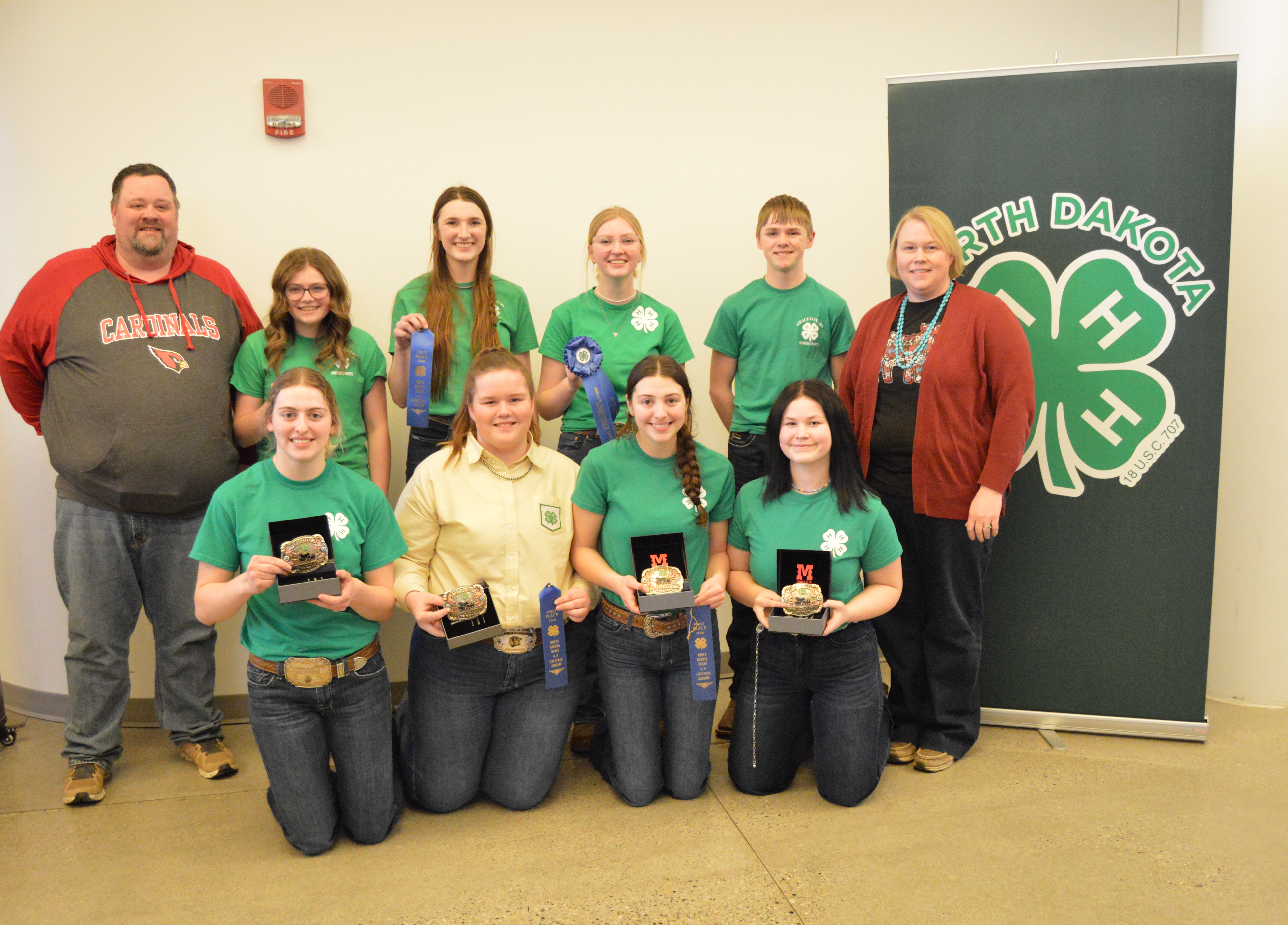 The Foster County team took first place in the senior division of the North Dakota 4-H State Livestock Judging Contest. Team members are (from left, front row) Kennedy Wendel, Molly Hansen, Isabel Wendel, Karlee Lesmann and (from left, back row) Coach Jory Hansen, Emma Aberle, Jozey Retzlaff, Haylie Spickler, Trace Spickler, Coach Missy Hansen (NDSU photo)