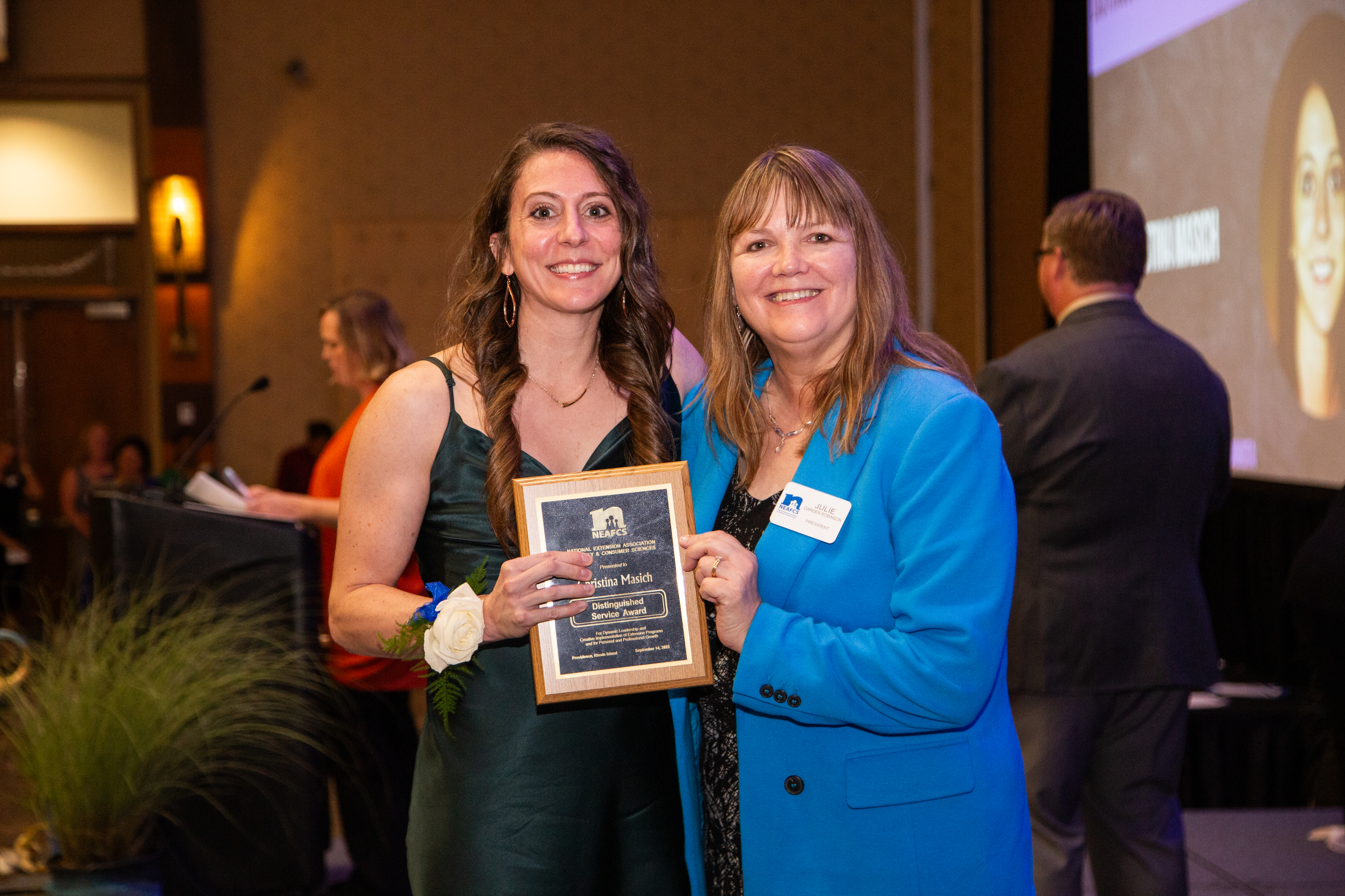 Christina Masich (left), NDSU Extension agent in Stutsman County, receives a Distinguished Service Award at the National Extension Association for Family and Consumer Sciences annual session. (NDSU photo)