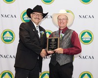 Rick Schmidt, Extension agent in Oliver County, receives the National Distinguished Service Award at the National Association of County Agricultural Agents conference. (NDSU photo)