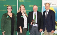 Mark Birdsall received NDSU’s Friend of Extension award. Pictured are Lynette Flage, associate director of NDSU Extension; Shana Forster, NDSU Extension district director and North Central Research Extension Center director; Birdsall and Greg Lardy, vice president of NDSU Agricultural Affairs. (NDSU photo)