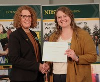 Torie Piehl (right) received the Meritorious Support Staff Award. She is pictured with Jodi Bruns, NDSU leadership and civic engagement specialist and president of Upsilon chapter of Epsilon Sigma Phi. (NDSU photo)