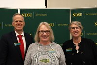 Lise Alves (center) is recognized for 10 years of service to NDSU Extension. Also pictured are Greg Lardy, vice president for NDSU Agriculture, and Lynette Flage, associate director for NDSU Extension. (NDSU photo)