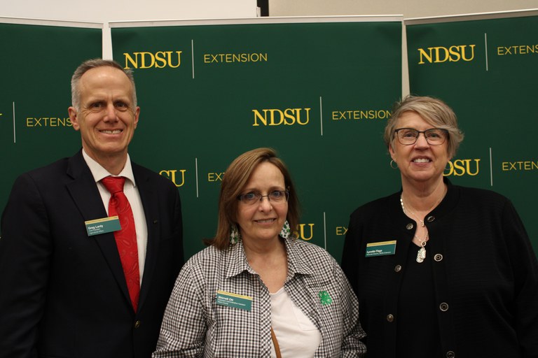 Shirrell Ott (center) is recognized for five years of service to NDSU Extension. Also pictured are Greg Lardy, vice president for NDSU Agriculture, and Lynette Flage, associate director for NDSU Extension. (NDSU photo)