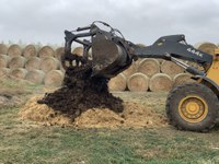 Covering dead livestock with 8 to 10 inches of bulking materials is one of the proper steps in composting an animal. Burial, composting, landfilling, incineration and rendering are all approved methods of carcass disposal. (NDSU photo)