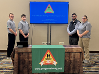 From left: 4-H'ers Chance Jacobson and Thomas Jewett; Toby Neal, volunteer and Progressive Agriculture Foundation data systems administrator and Angie Johnson, NDSU Extension farm and ranch safety coordinator. (NDSU photo)