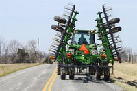 The responsibility of safely sharing the road during spring planting season falls on both farm equipment operators and general motorists. (Upper Midwest Agricultural Safety and Health photo)
