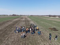 Farmers view a soil pit as part of an on-farm soil health research project. (NDSU photo)