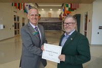 Christopher Schauer (20 years) receives congratulations from Greg Lardy. (NDSU photo)