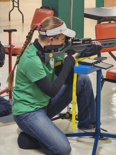 Cady Malmedal (Ward County) fires while kneeling in the senior division. (NDSU photo)
