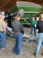 Angie Johnson, NDSU Extension farm and ranch safety specialist, explains safety procedures around an auger. (NDSU photo)