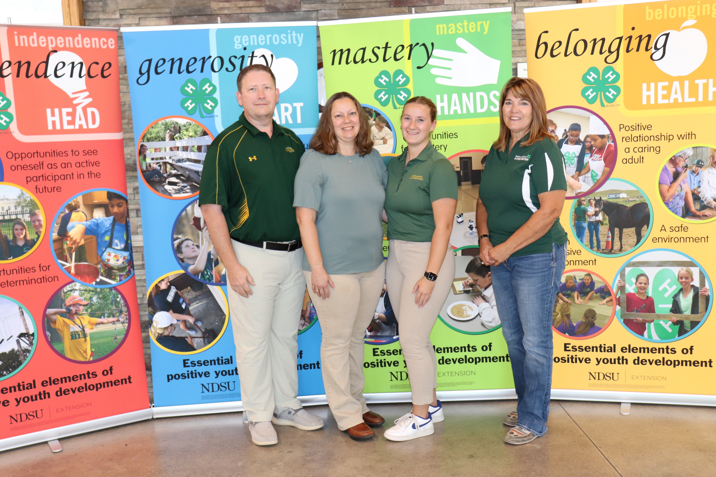 Dawn Thomsen is recognized as the 2025 Volunteer of the Year. Pictured from left: Brent Thomsen; Dawn Thomsen; Alyssa Thomsen and Becky Peterson, North Dakota 4-H Foundation chair. (NDSU photo)
