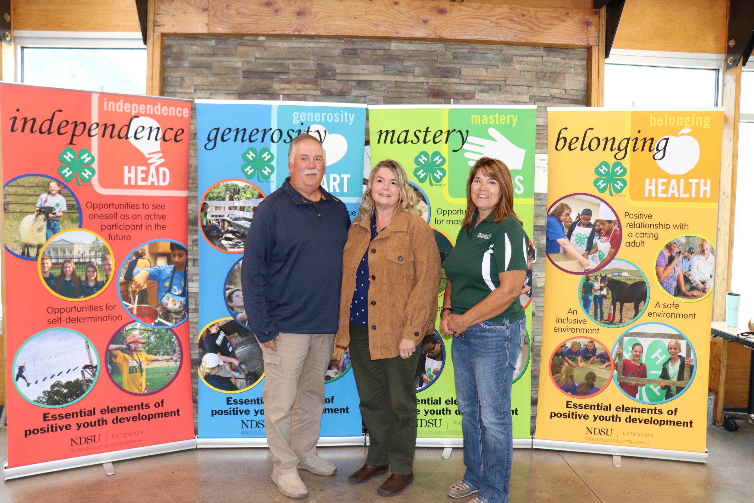 The Nelson family is recognized as a North Dakota 4-H Century Family. Pictured from left: Brent Nelson; Becky Nelson and Becky Peterson, North Dakota 4-H Foundation chair. (NDSU photo)