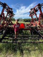 Reese Eggert of Becker County, Minnesota, placed second for properly installing a slow-moving vehicle sign on a Case-International vibra shank cultivator. (NDSU photo)