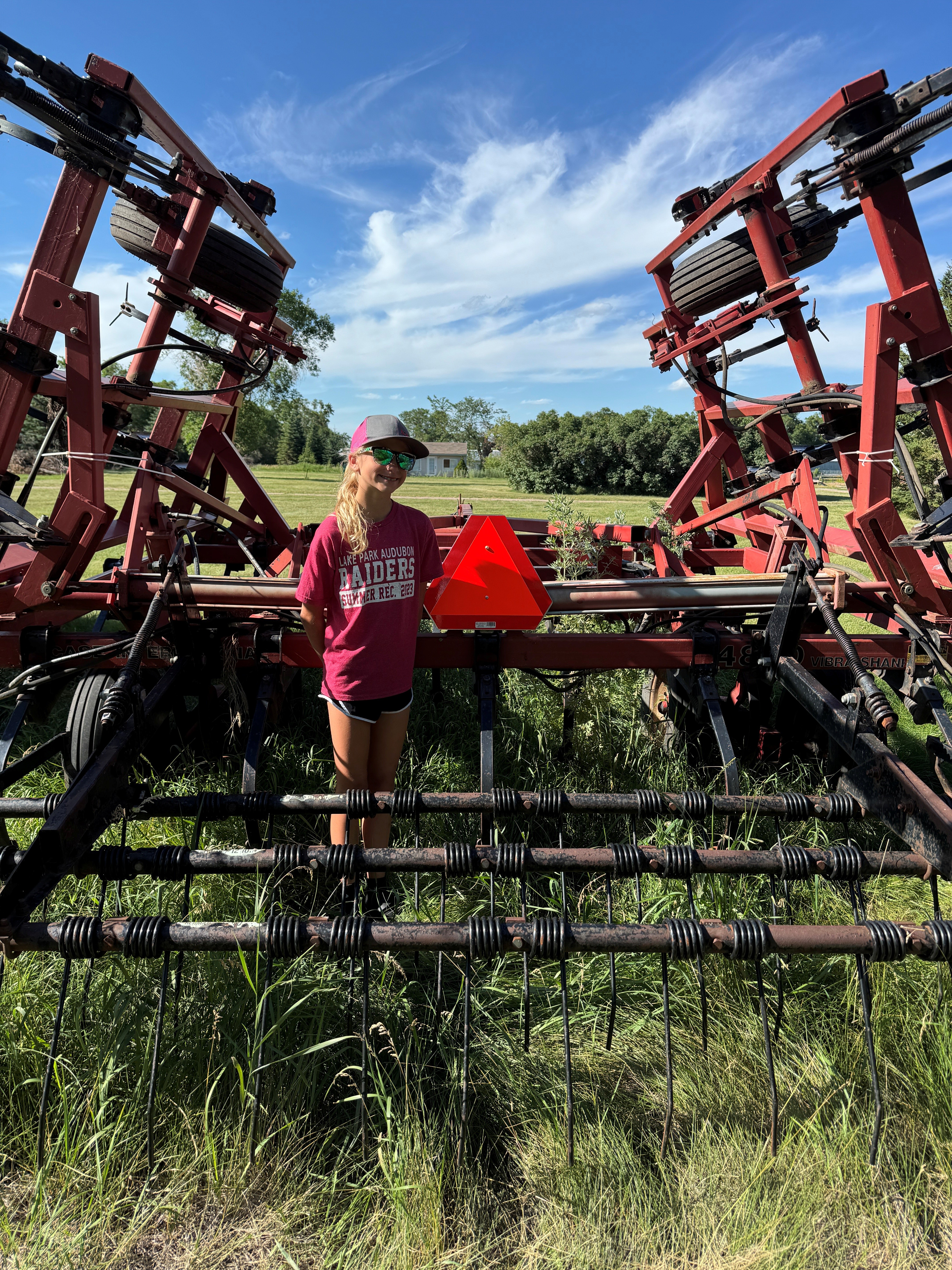 Reese Eggert of Becker County, Minnesota, placed second for properly installing a slow-moving vehicle sign on a Case-International vibra shank cultivator. (NDSU photo)