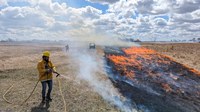 At the Albert K. Ekre Grassland Preserve, students help monitor a prescribed fire; these fires have many benefits, including reducing woody plant encroachment, managing invasive species and improving forage quality for livestock. (NDSU photo)